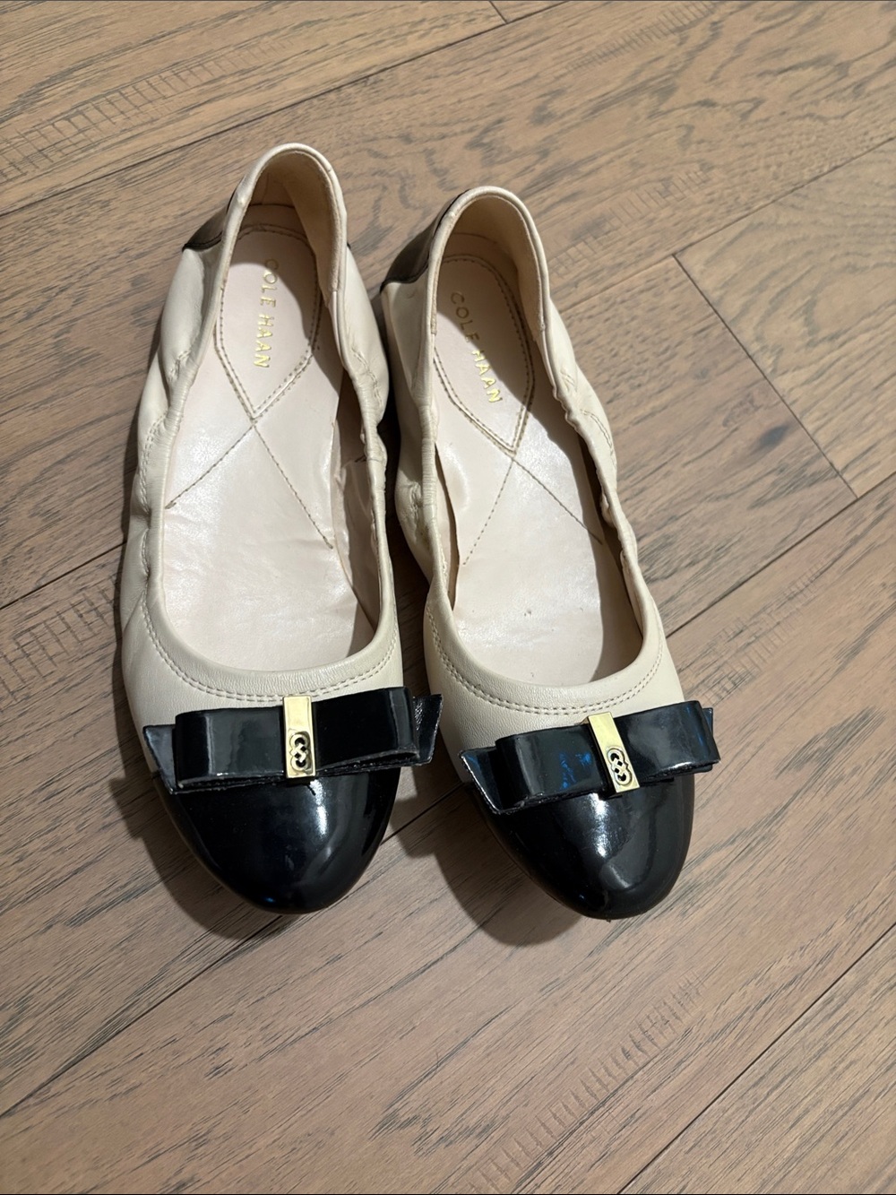Cole Haan Two-Tone Bow Cap-Toe Flats in Cream and Black